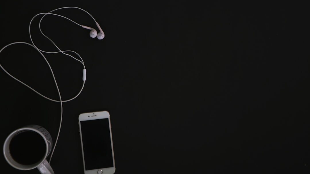 Flat lay of smartphone, smartwatch and earbuds
